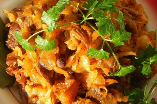 Braised cabbage with meat in a pan