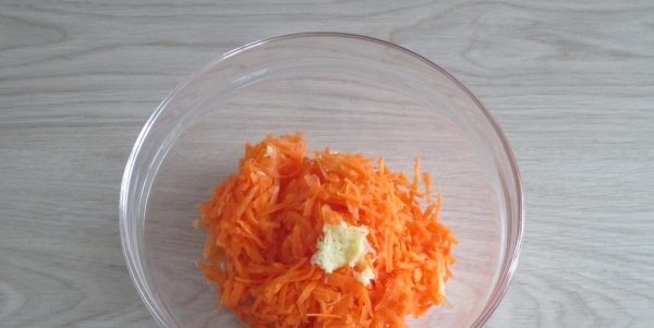 Vitamin carrot salad with garlic and cheese for a festive feast and daily menu