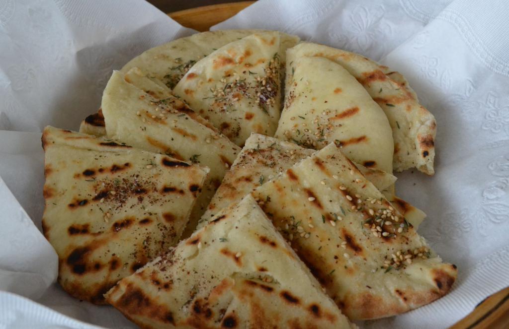 Pan-fried pita bread with cheese and herbs